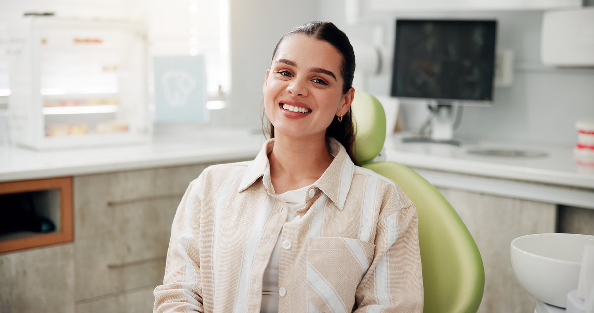 Woman, portrait and smile at dentist for oral hygiene, teeth whitening consultation or healthcare checkup. Dental care, medical and patient for cavity extraction, root canal examination and service.