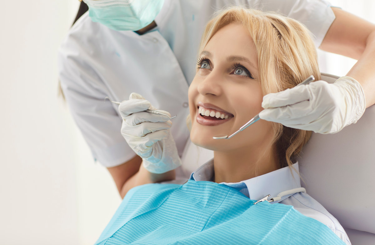 Stomatology clinic service, perfect white toothy smile, whitening treatment procedure result, health dentistry oralcare, dentist doctor working with happy female patient sitting in dental chair