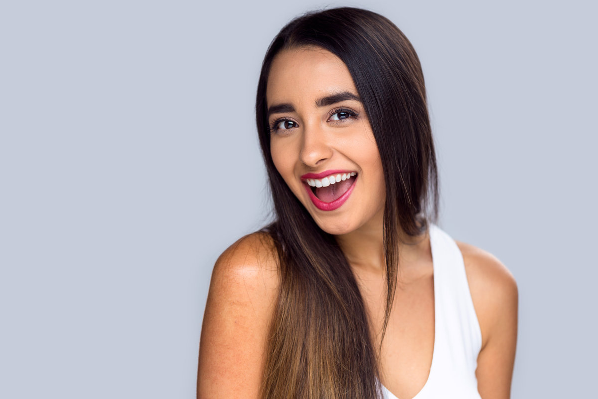 beautiful girl showing a perfect smile